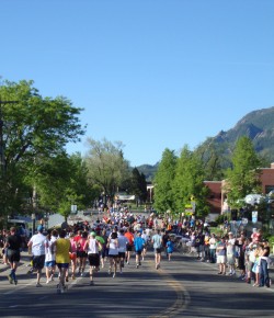 Nearly there, BolderBOULDER participants pass the 4-mile mark on their way to Folsom Stadium. © Take The Magic Step
