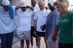 Back on My Feet members pray before their run.