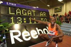 An elated Lagat points to his new record. © www.photorun.net