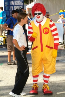 Uta and sponsor Ronald McDonald discuss running shoes. © Take The Magic Step®