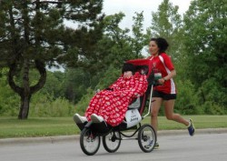 Courage: Jenny and her friend, Elva Dryer, inspire crowds on the course. © Courtesy of Bellin Run 