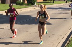 Risper Gesabwa and Kaitlin Gregg Goodman ran side by side on this warm day in Green Bay. © Michael Reger