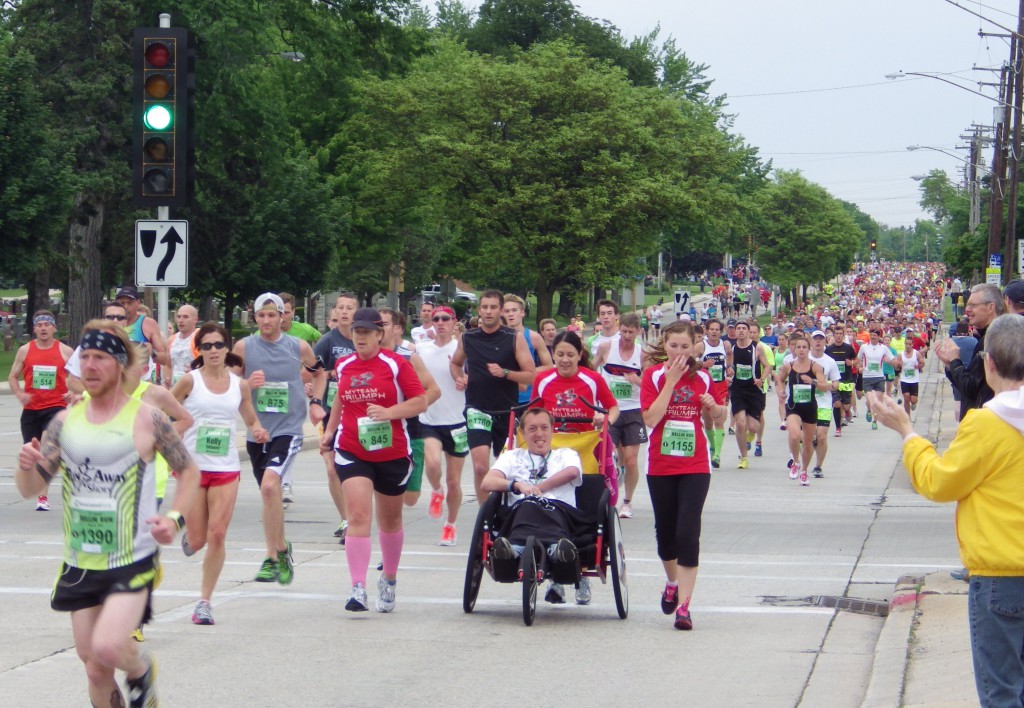 One of 22 TEAM TRIUMPH teams with its captain and the support of three angels makes its way to the finish line. © Take The Magic Step®