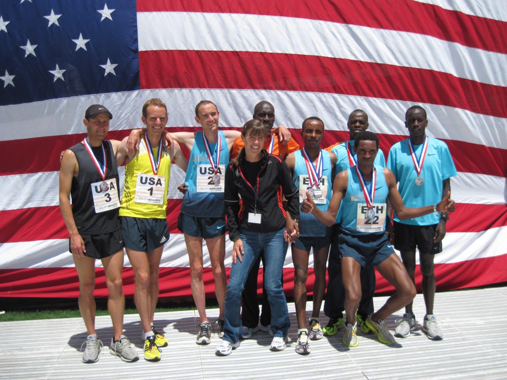 The top-three teams Kenya (Lani Rutto, Allan Kiprono, Leonard Korir), Ethiopia (Birhanu Gedefa, Belete Assefa), and America (Kenyon Nueman, Aaron Braun, Brent Vaughn) celebrate a great competition on Memorial Day. © Uta Pippig and Take The Magic Step®