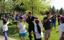 "High Fives" with the Columbine Kids and Uta before their 37th Columbine Mile Marathon in Boulder. © Take The Magic Step