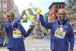 Edna Kiplagat and Geoffrey Kirui celebrate on Boylston Street after their exciting races. © www.PhotoRun.net