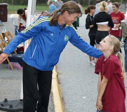 “Congratulations, little running girl, on your race!” ...at the fundraiser for the Louisa May Alcott Orchard House. © John Kennard