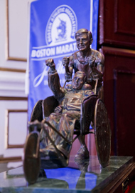 John Hancock Financial commissioned a statue to capture the inspiring character and spirit of Dick and Rick Hoyt. The life-sized statue was unveiled in April 2013 at the Center School in Hopkinton. © Courtesy of Team Hoyt