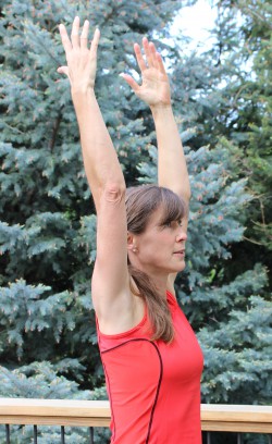 Extended Mountain pose—Urdhva Tadasana. © Take The Magic Step