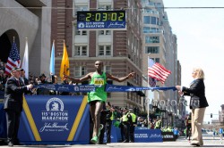 Geoffrey Mutai crossed the finish line beside the Boston Library in a world-best time of 2:03:02 in April, 2011. © www.photorun.net
