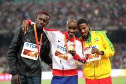 Caleb Ndiku, Mo Farah, and Hagos Gebrhiwet medaled in the 5,000m. © www.PhotoRun.net