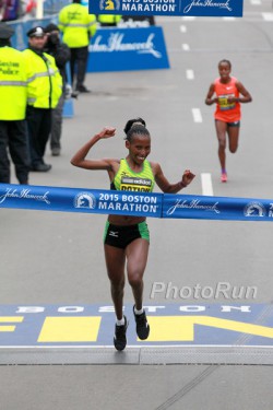 Caroline Rotich celebrates her victory as she crosses the finish line. © www.PhotoRun.net