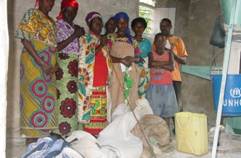 These needy widows had their grain ground for free thanks to PeopleWeaver. © Courtesy of PeopleWeaver