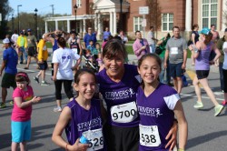 Two happy STRIVERS finishers, who ran their “Women Run with STRIVERS” Mother’s Day 5K together with Uta. © Take The Magic Step